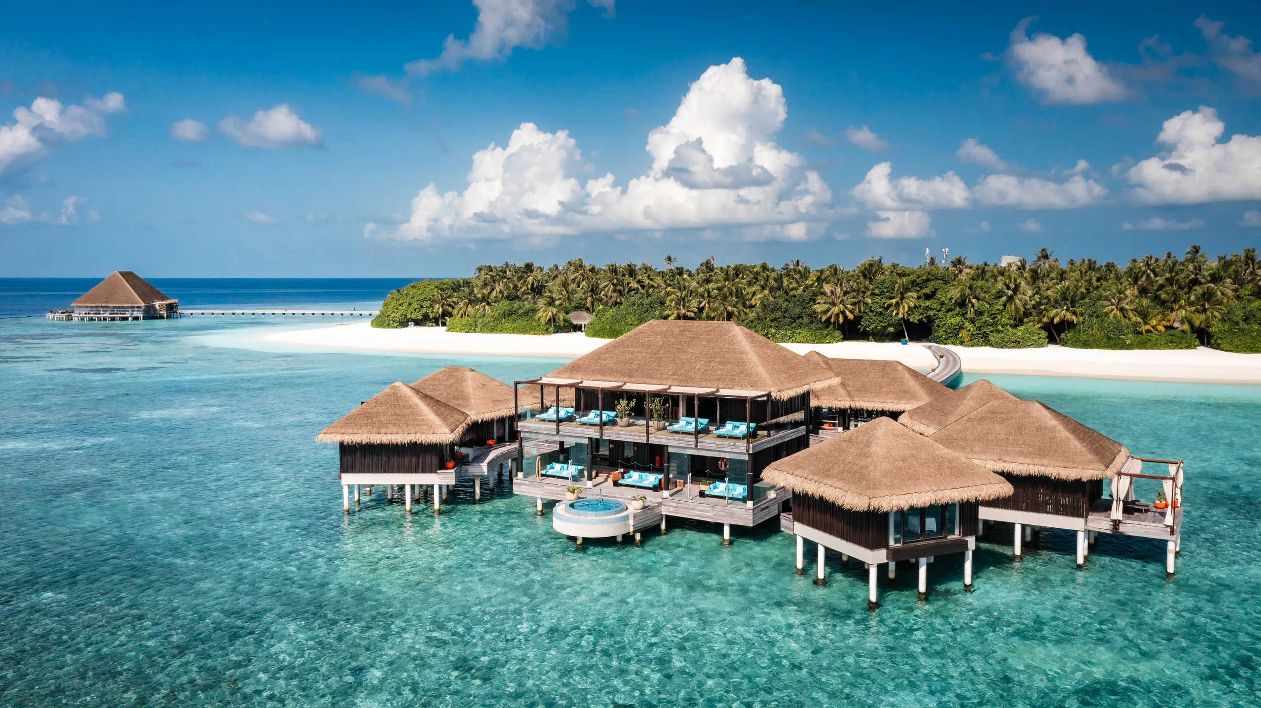 Luxury overwater villa at golden hour